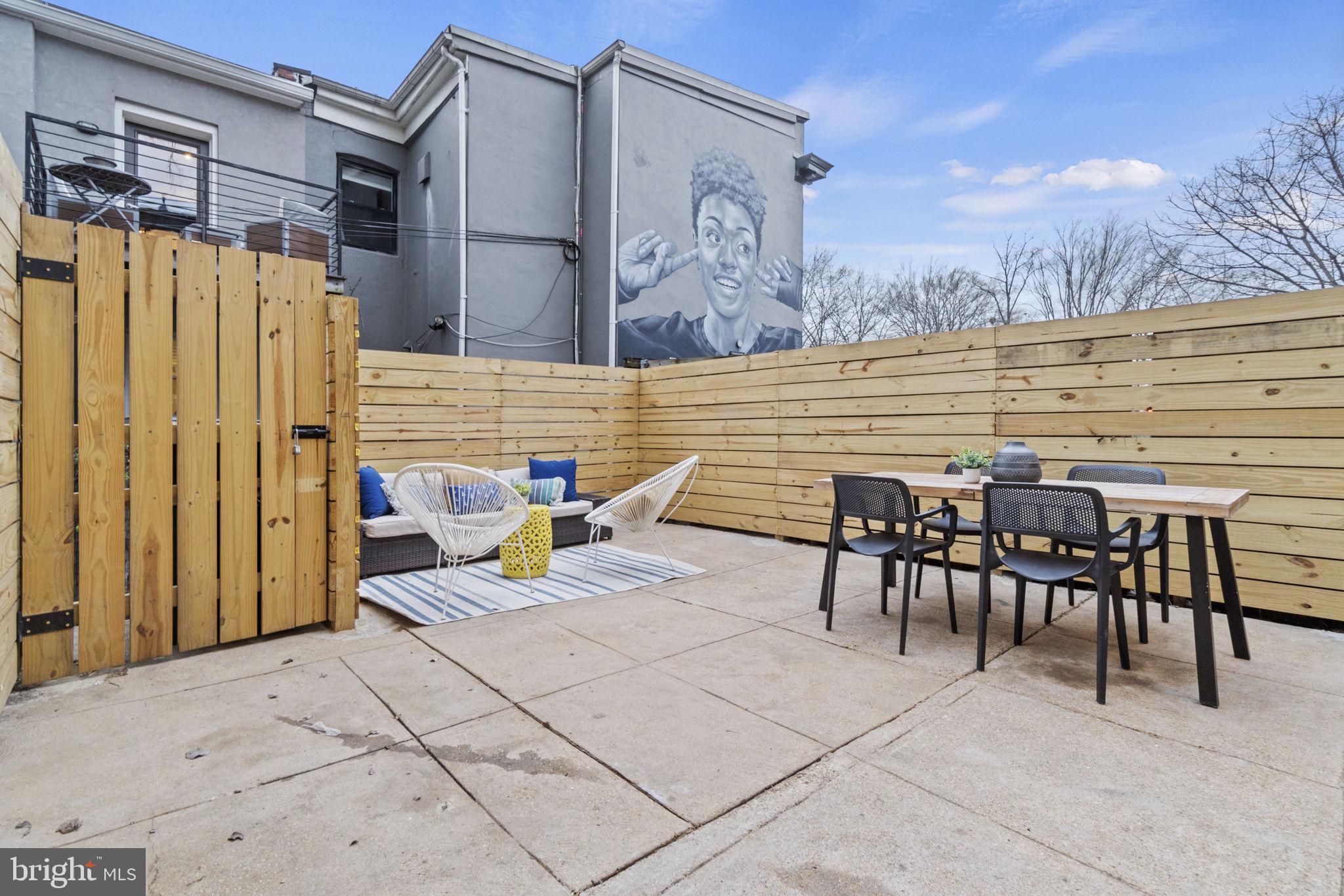 92 R Street Northwest Washington, DC 20001 - Photo 32 of 36 a view of a patio with dining table and chairs