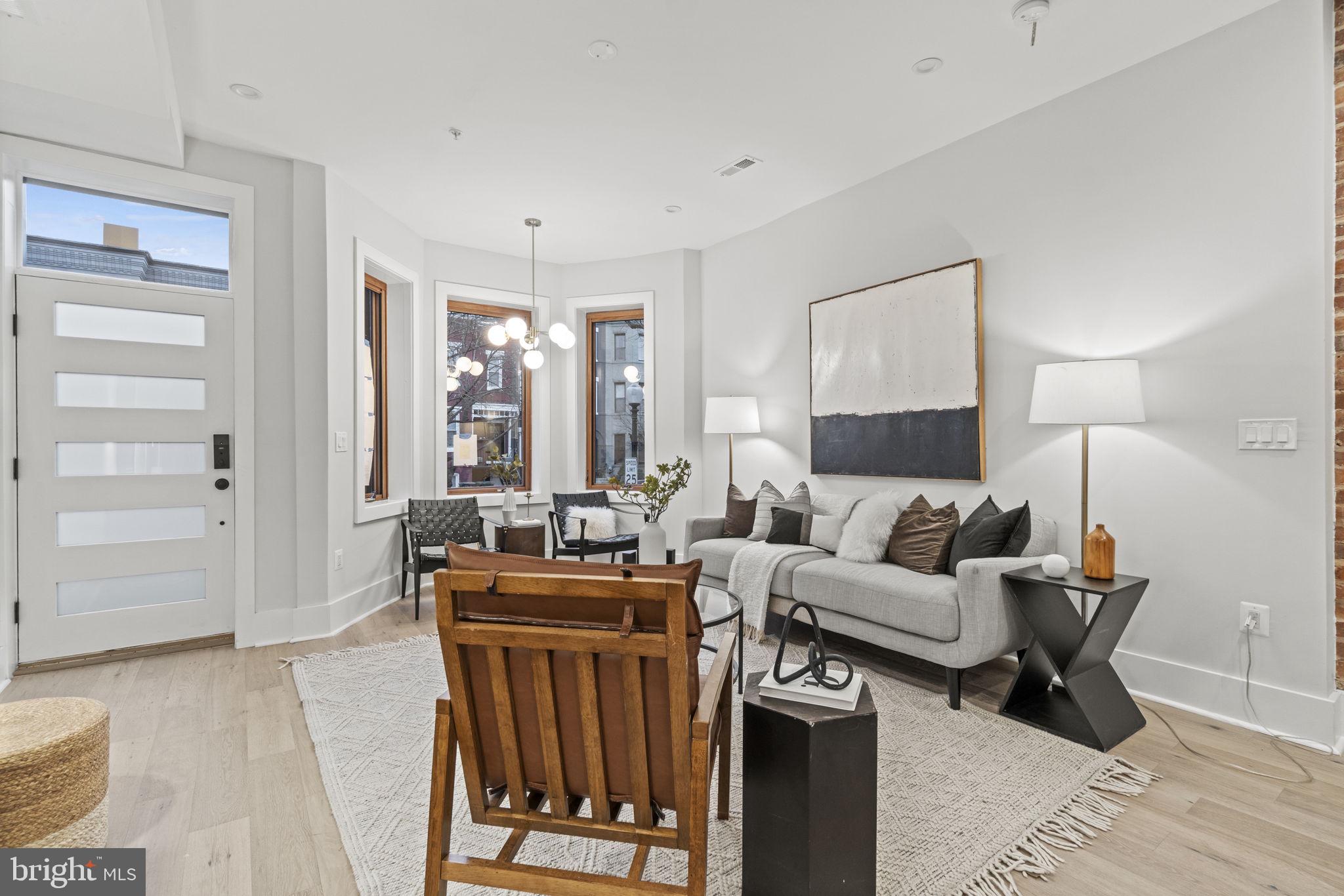 92 R Street Northwest Washington, DC 20001 - Photo 4 of 36 a living room with furniture a window and a table