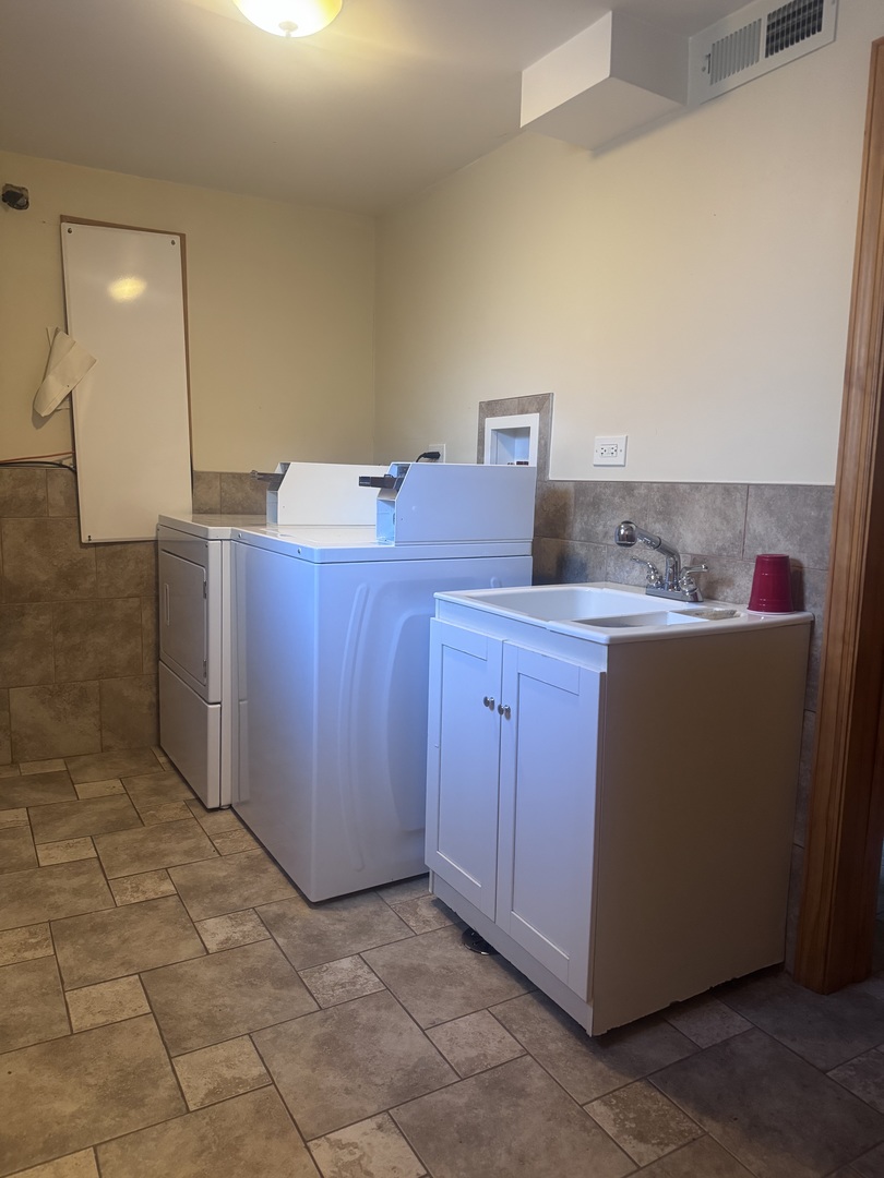 12255 South McDaniels Street, Unit GN Alsip, IL 60803 - Photo 11 of 11 a room with a sink cabinets and utility room