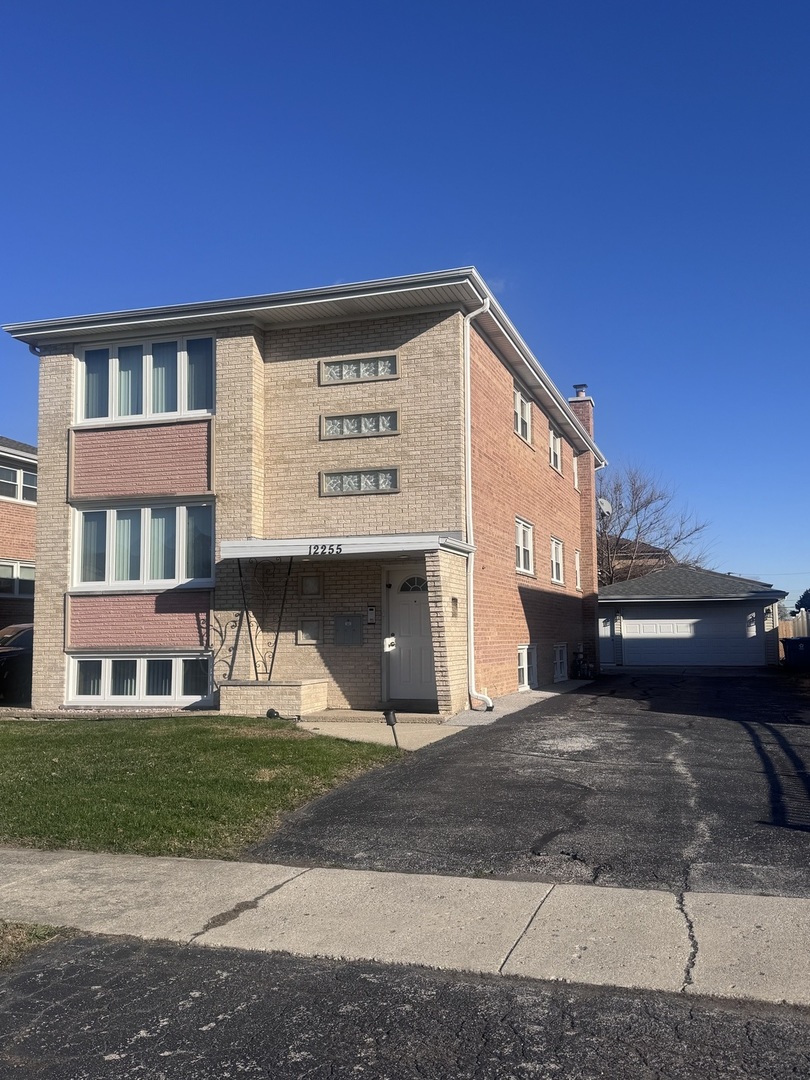 12255 South McDaniels Street, Unit GN Alsip, IL 60803 - Photo 2 of 11 a view of a building with a street