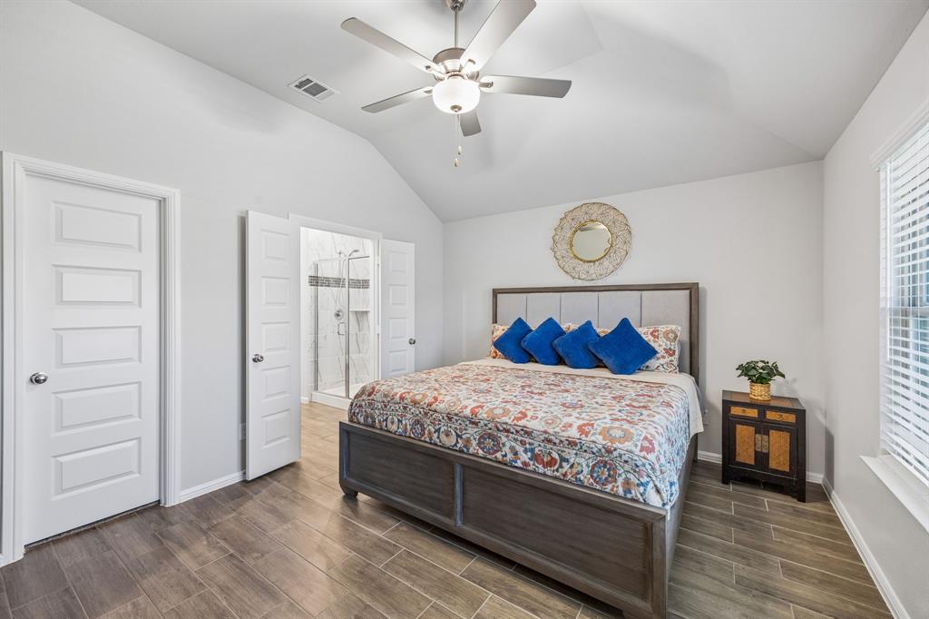 14061 Earlham Street Pilot Point, TX 76258 - Photo 8 of 10 a bedroom with a bed and a table
