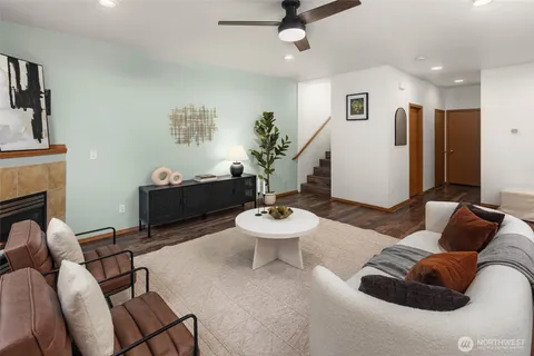 a living room with furniture and a fireplace