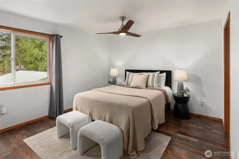a bedroom with a bed and window