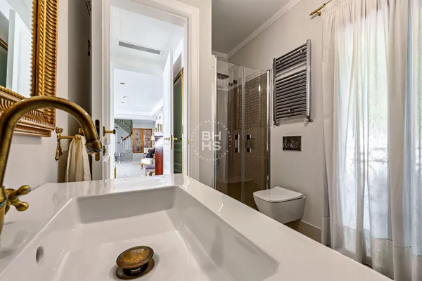 a bathroom with a tub and a sink
