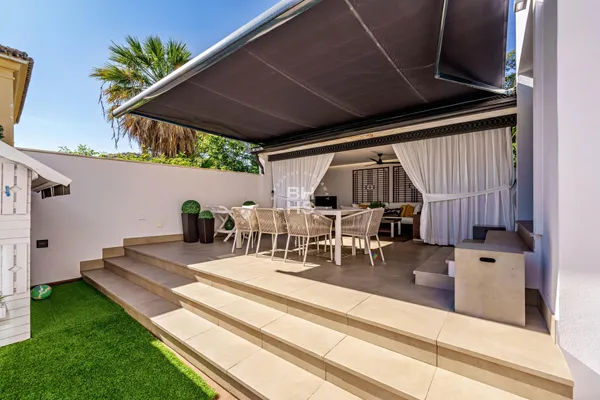 a view of swimming pool with seating area