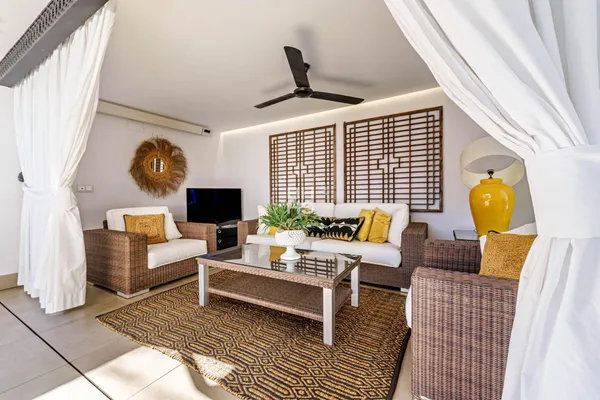 a living room with furniture and a fireplace