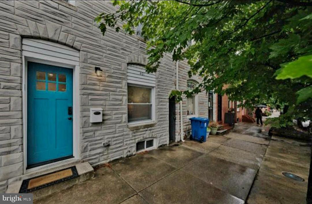 401 South Ann Street Baltimore, MD 21231 - Photo 1 of 30 a view of a brick house with a large tree