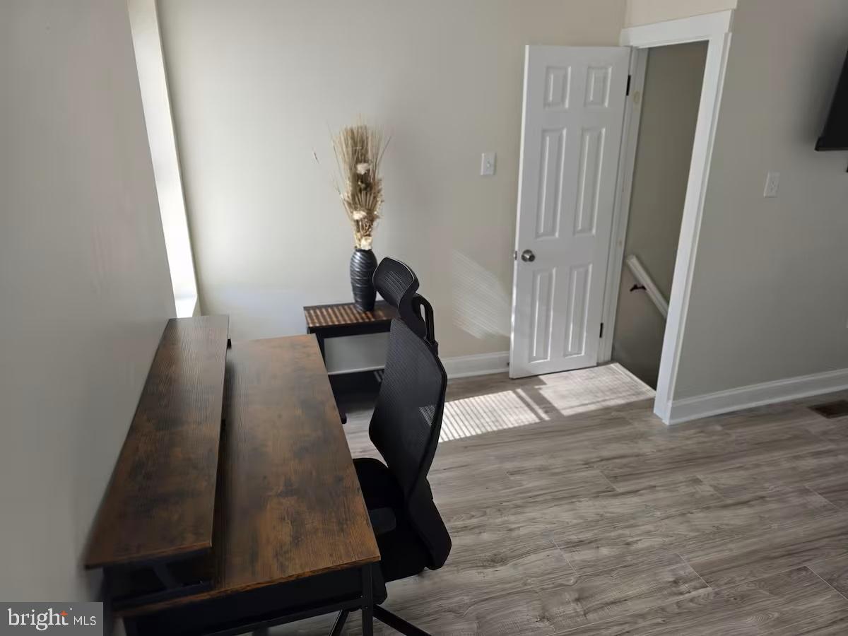 401 South Ann Street Baltimore, MD 21231 - Photo 11 of 30 a view of entryway with wooden floor