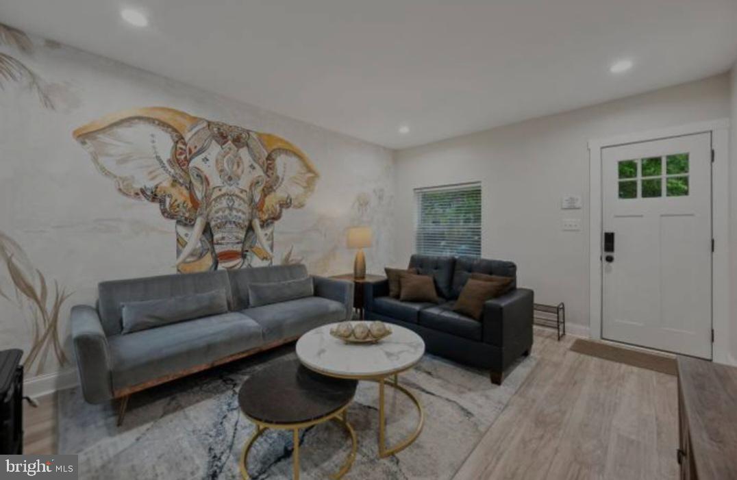 401 South Ann Street Baltimore, MD 21231 - Photo 15 of 30 a living room with furniture and a wooden floor