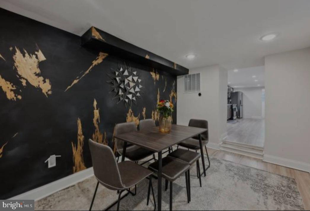 401 South Ann Street Baltimore, MD 21231 - Photo 18 of 30 a view of a dining room with furniture and wooden floor