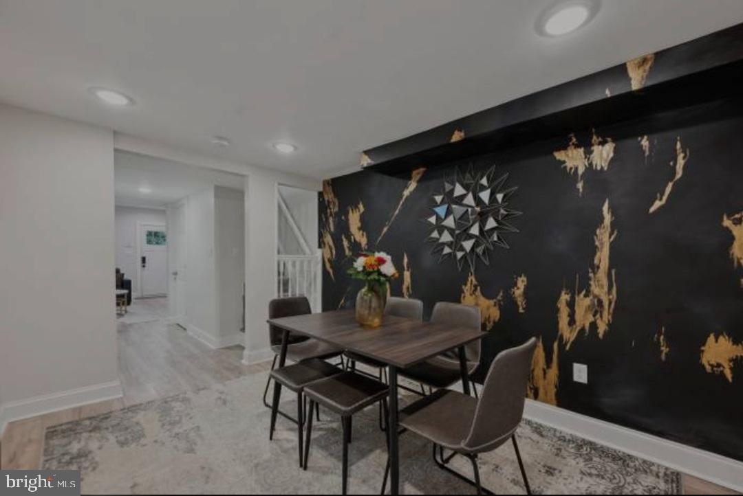 401 South Ann Street Baltimore, MD 21231 - Photo 20 of 30 a view of a dining room with furniture and wooden floor