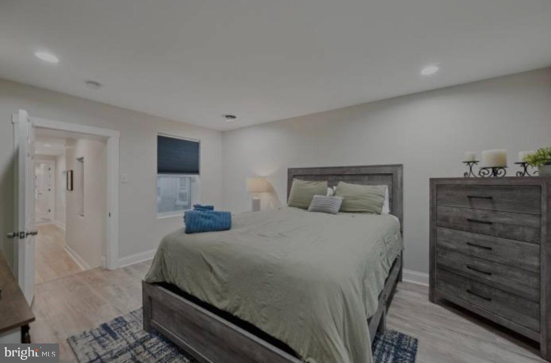 401 South Ann Street Baltimore, MD 21231 - Photo 28 of 30 a bedroom with a bed and a dresser