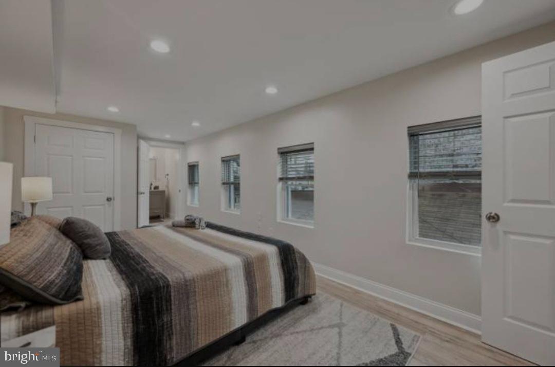 401 South Ann Street Baltimore, MD 21231 - Photo 5 of 30 a bedroom with a bed and a window