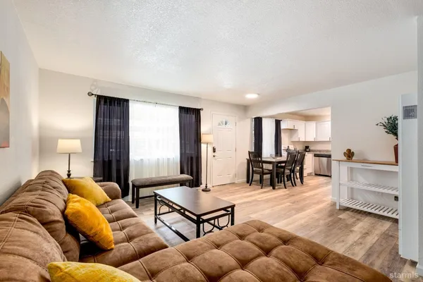 a bedroom with a bed and a table in it
