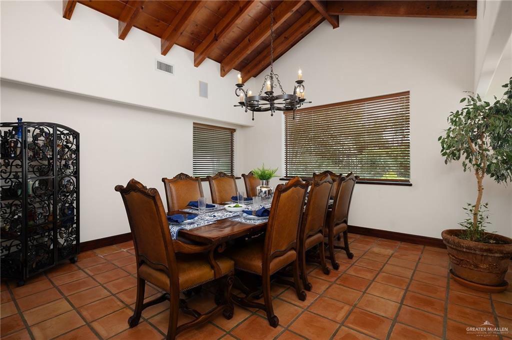 3506 Oak Ridge Lane Mission, TX 78573 - Photo 11 of 45 a view of a dining room with furniture and window