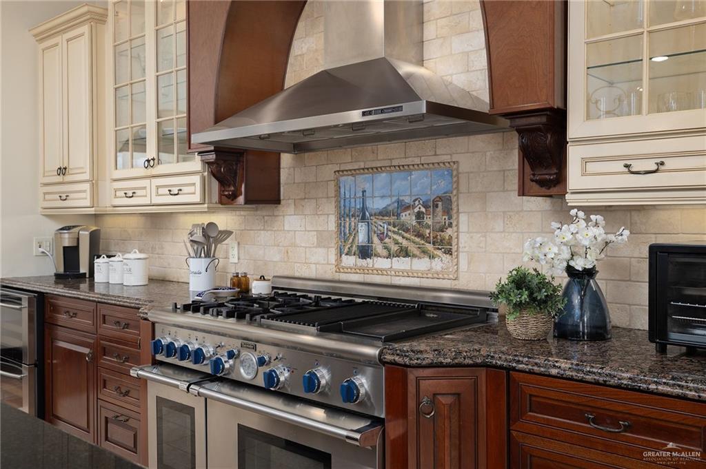 3506 Oak Ridge Lane Mission, TX 78573 - Photo 17 of 45 a kitchen with granite countertop stainless steel appliances stove and cabinets
