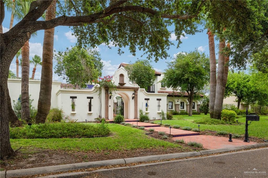 3506 Oak Ridge Lane Mission, TX 78573 - Photo 2 of 45 a front view of a house with a yard garage and plants