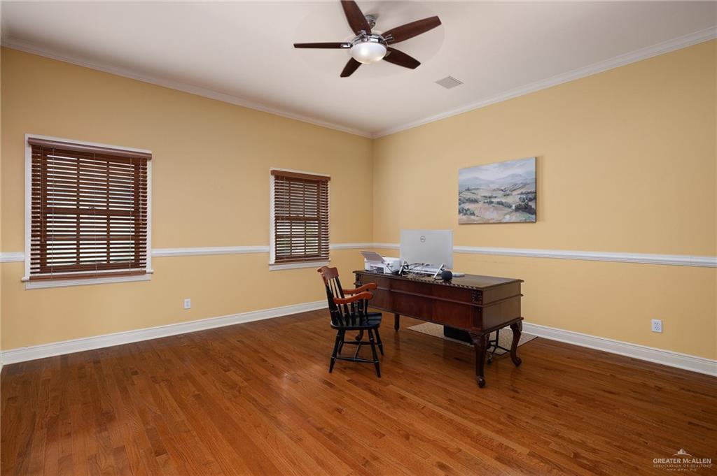 3506 Oak Ridge Lane Mission, TX 78573 - Photo 27 of 45 a view of a workspace with furniture and a window