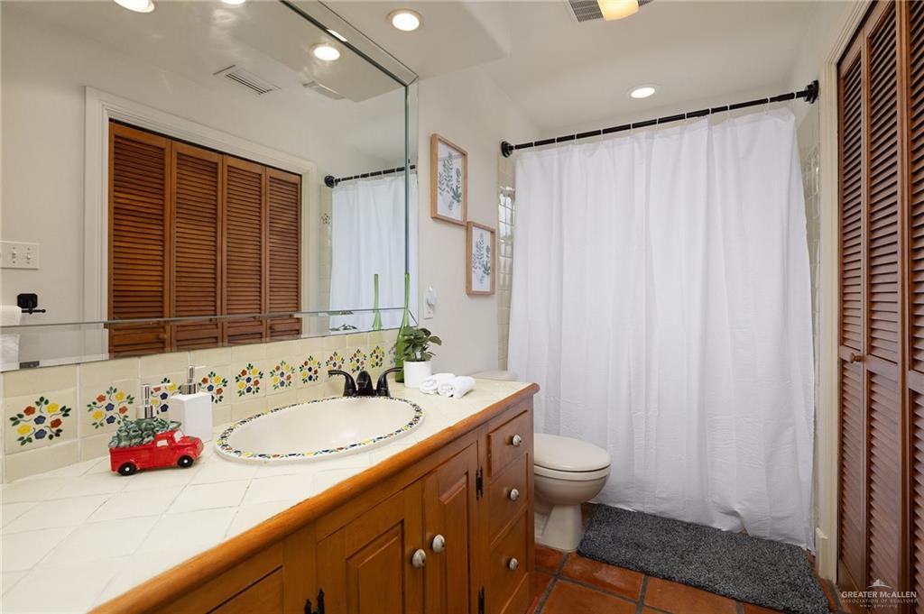 3506 Oak Ridge Lane Mission, TX 78573 - Photo 31 of 45 a bathroom with a sink and a mirror