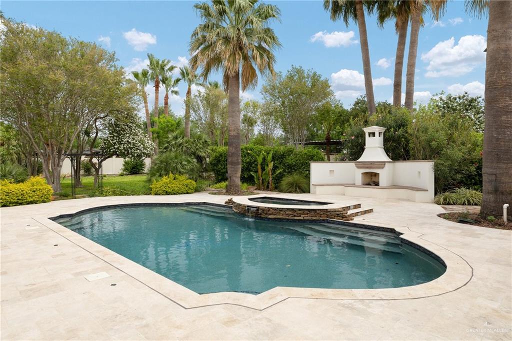 3506 Oak Ridge Lane Mission, TX 78573 - Photo 34 of 45 a view of a swimming pool with a garden