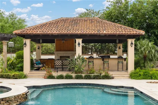 a view of a patio with table and chairs potted plants with wooden floor