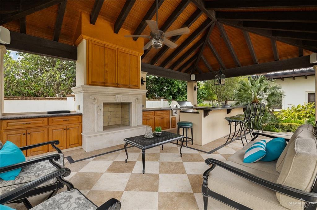3506 Oak Ridge Lane Mission, TX 78573 - Photo 39 of 45 a view of a patio with table and chairs potted plants with wooden floor
