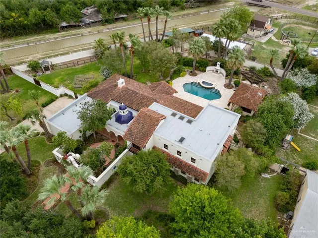an aerial view of a house with outdoor space