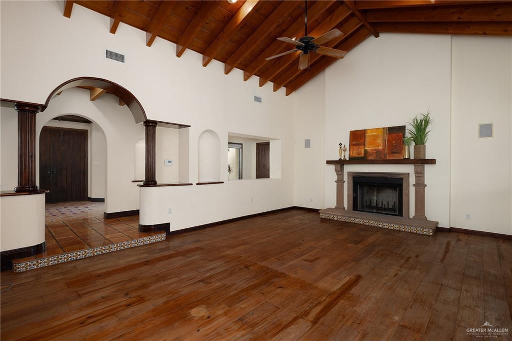 3506 Oak Ridge Lane Mission, TX 78573 - Photo 8 of 45 a view of empty room with wooden floor and fireplace