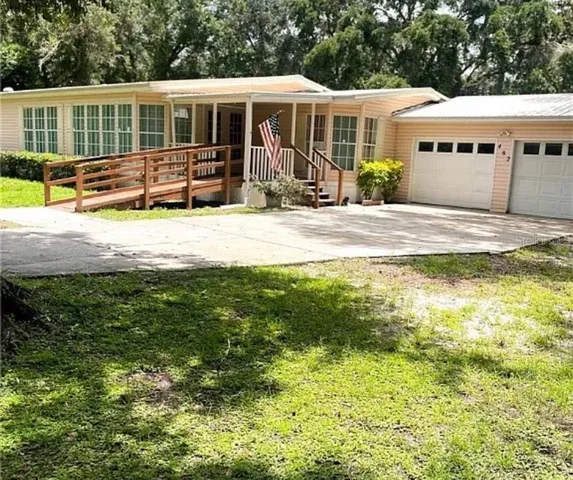 a front view of a house with a yard patio and fire pit