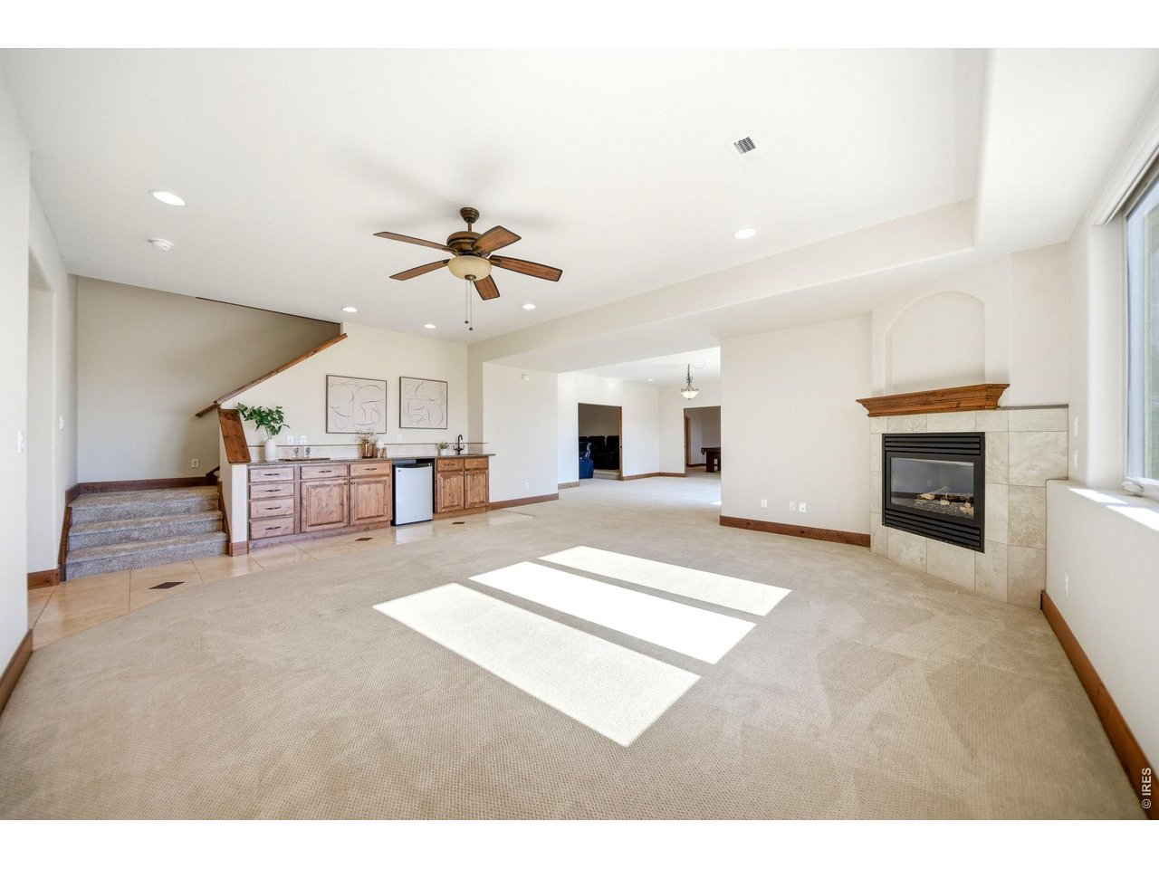 2153 Mountain River Road Berthoud, CO 80513 - Photo 28 of 50 Spacious and open lower level complete with a cozy gas fireplace