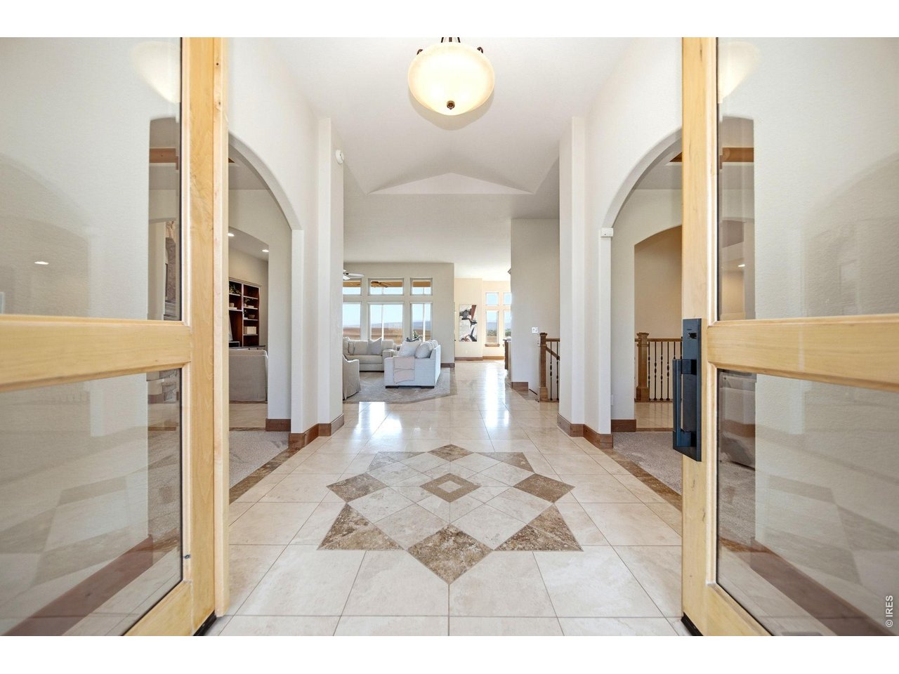 2153 Mountain River Road Berthoud, CO 80513 - Photo 3 of 50 A bright and airy entrance featuring elegant tile work and soaring ceilings