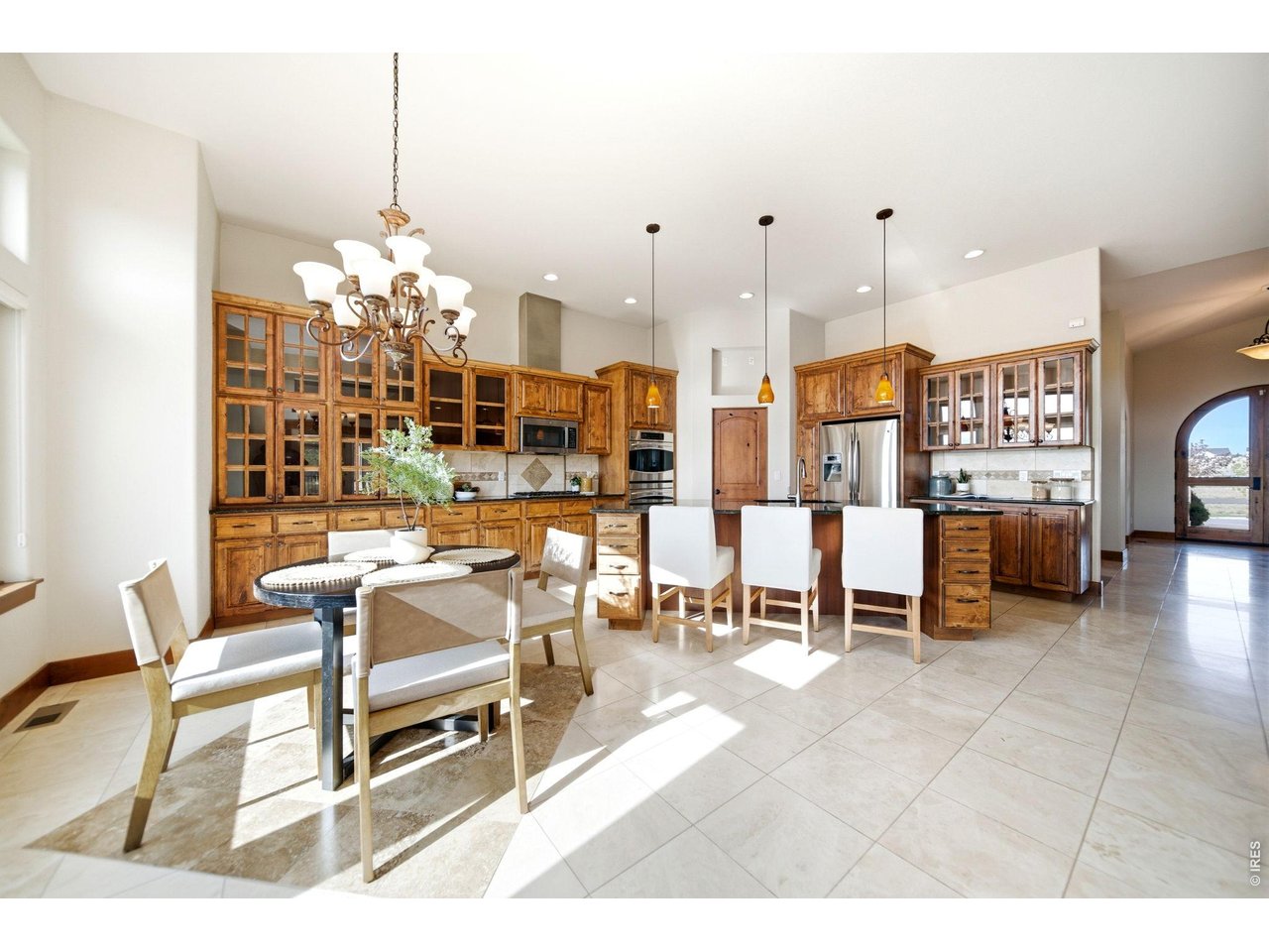 2153 Mountain River Road Berthoud, CO 80513 - Photo 7 of 50 A chef's kitchen featuring rich wood cabinetry and premium appliances