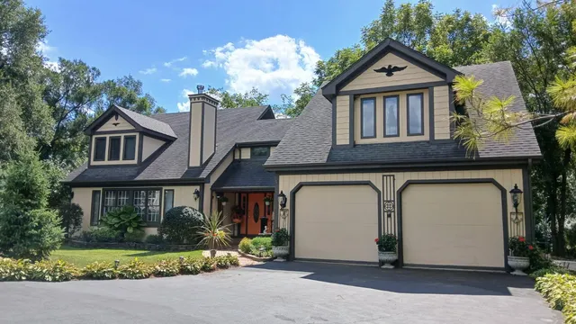 a front view of a house with garden