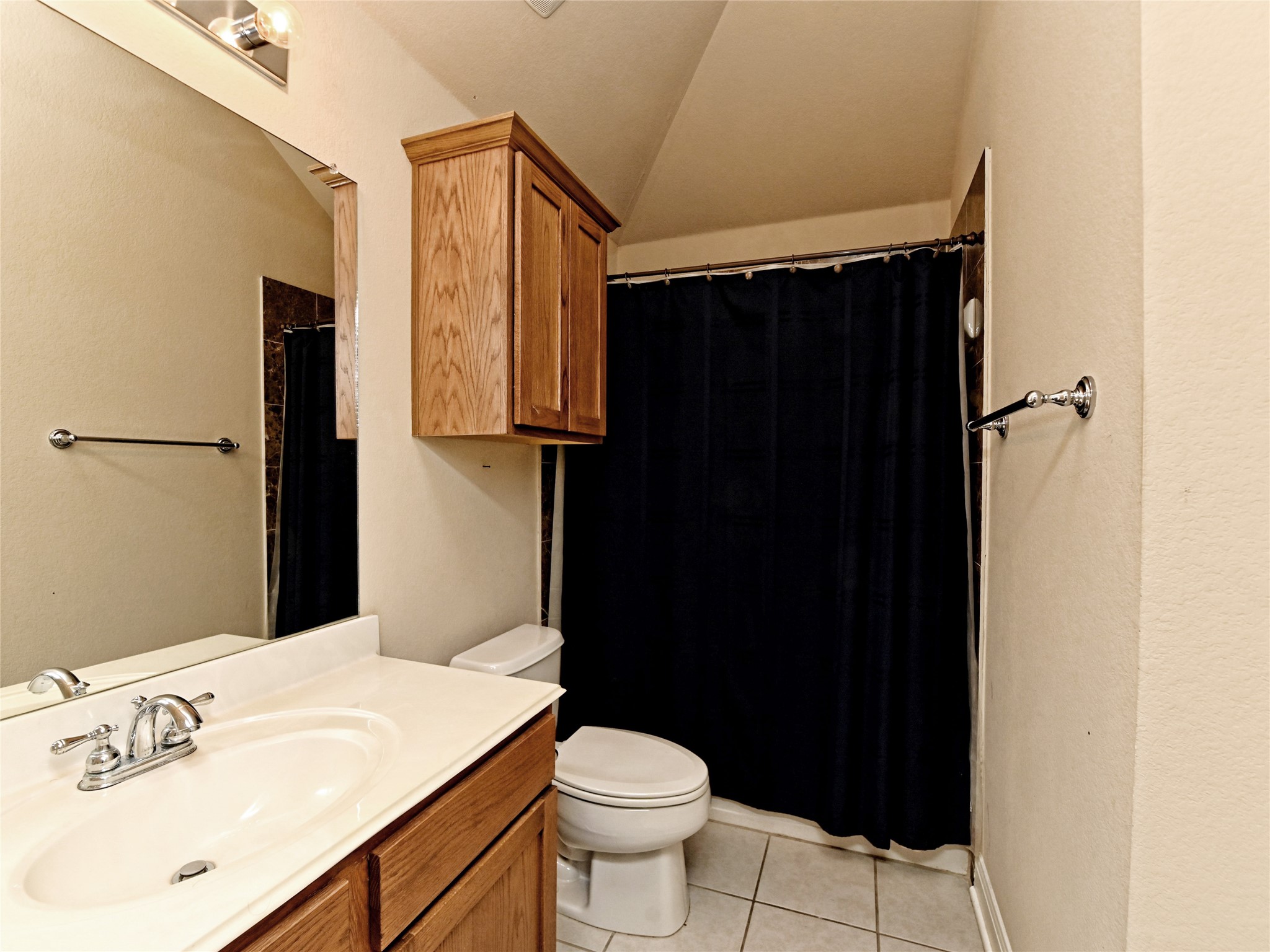 230 Sunrise Ridge Loop Austin, TX 78738 - Photo 22 of 27 Functional bathroom featuring a single vanity and a shower-tub combination for everyday convenience.