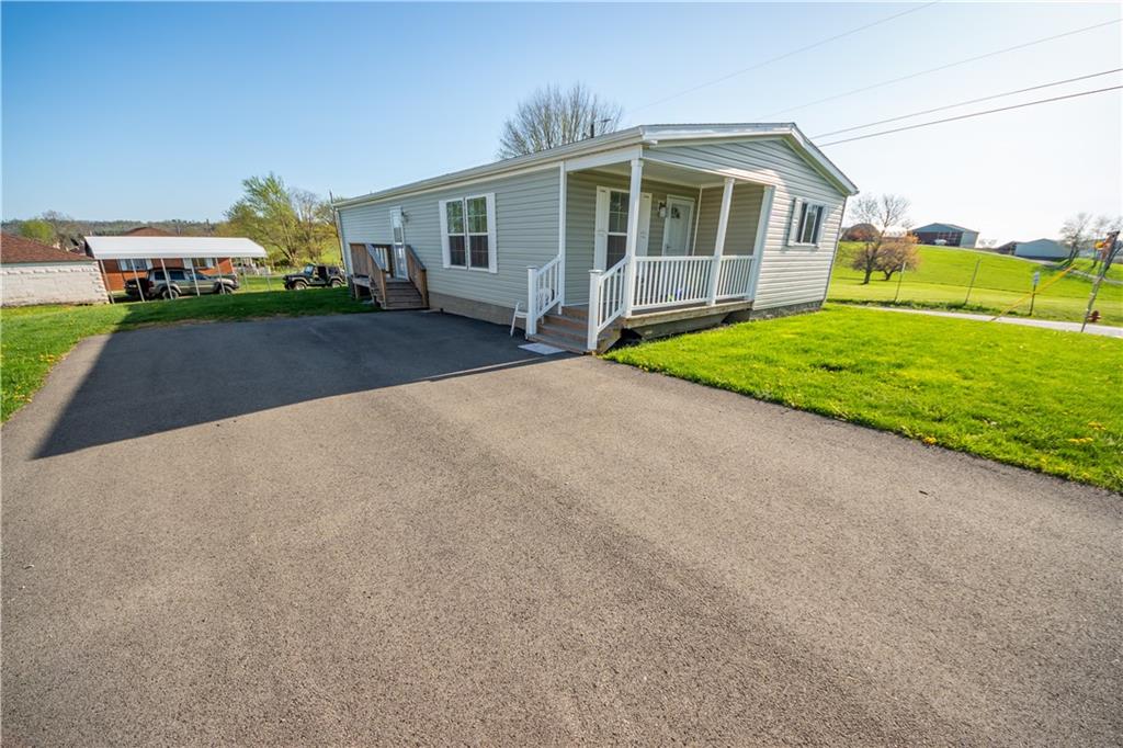 910 Jefferson Road Waynesburg, PA 15370 - Photo 2 of 17 a front view of a house with garden