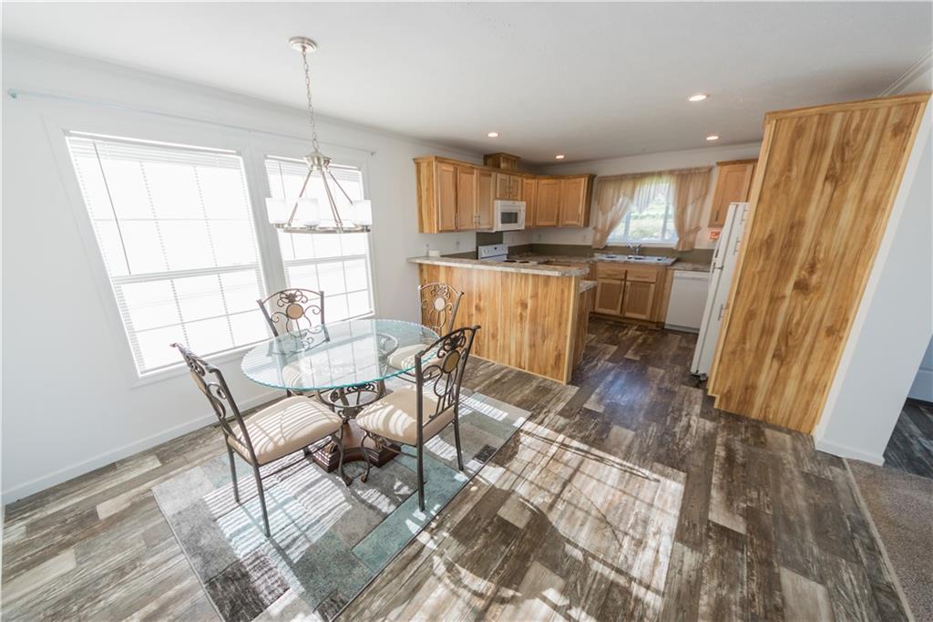 910 Jefferson Road Waynesburg, PA 15370 - Photo 5 of 17 a view of a dining room with furniture window and wooden floor