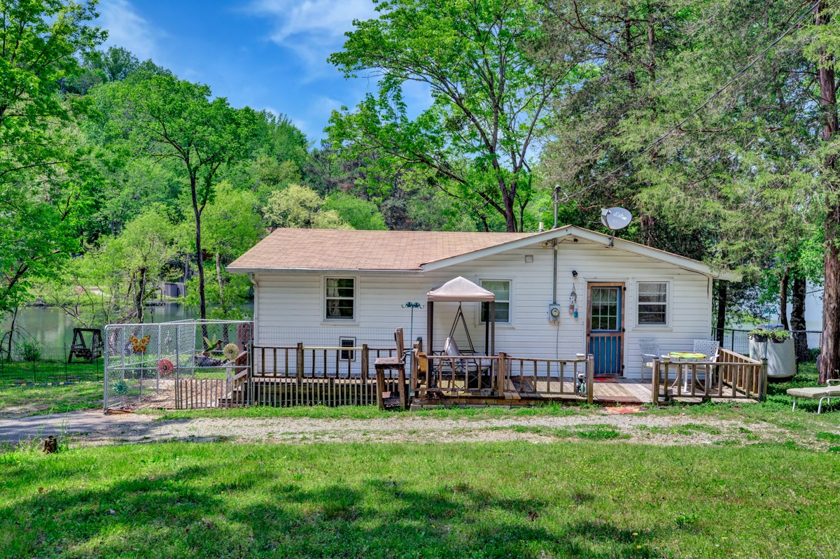 1227 Lake Logan Road Ardmore, TN 38449 - Photo 1 of 29 a view of a house with a backyard