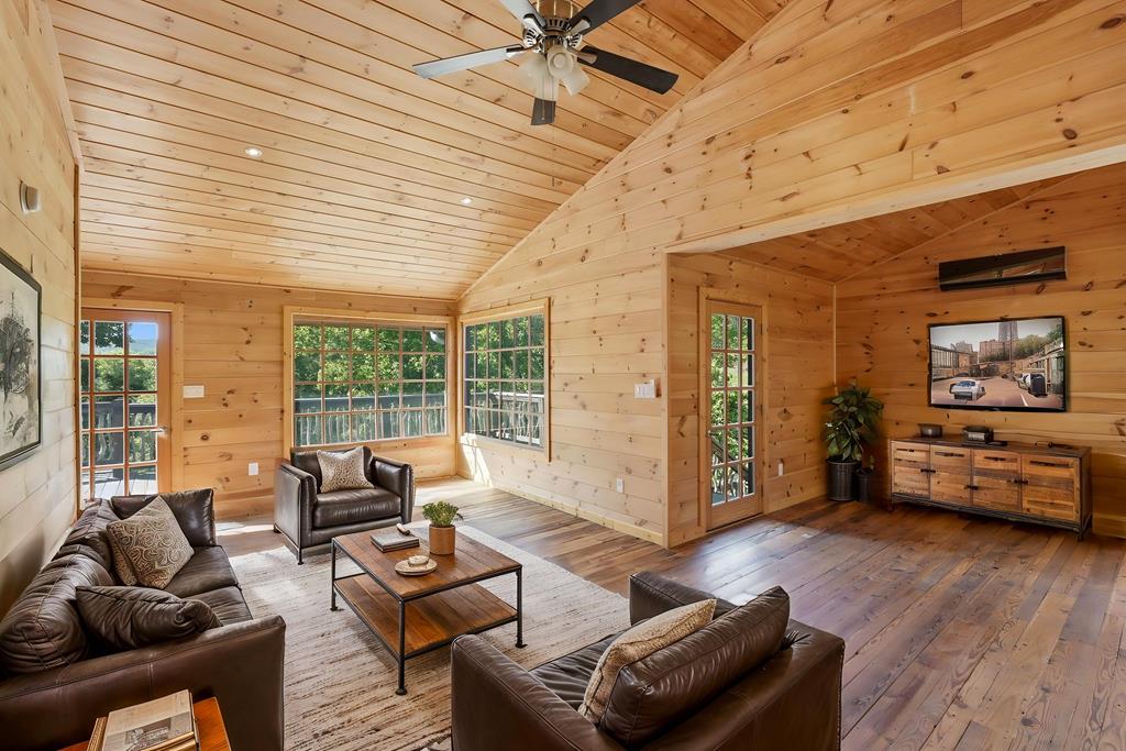 1823 Shoal Creek Road Clarkesville, GA 30523 - Photo 100 of 149 a living room with furniture and wooden floor