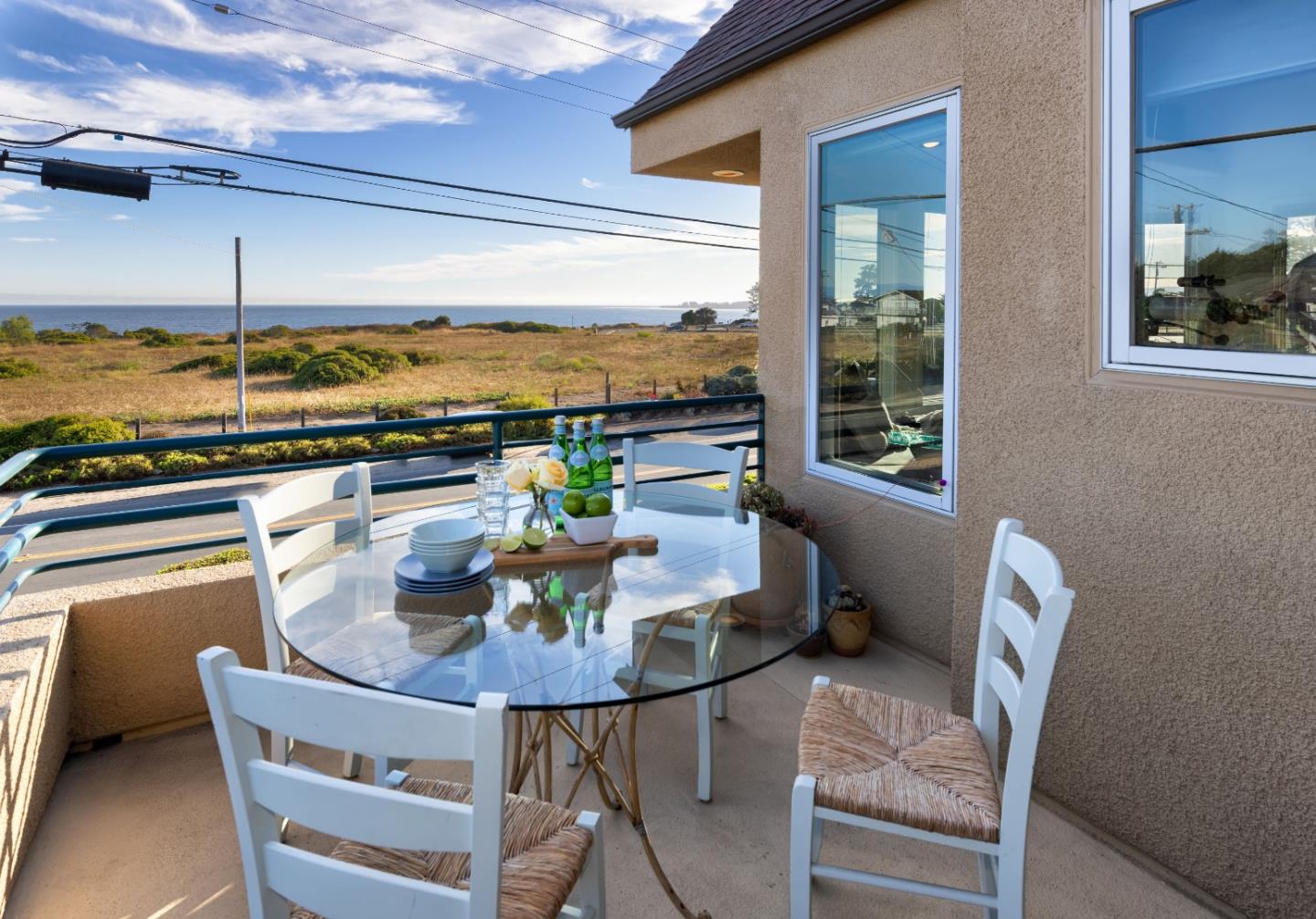 202 Seacliff Drive Aptos, CA 95003 - Photo 11 of 36 a dining room with furniture and a floor to ceiling window