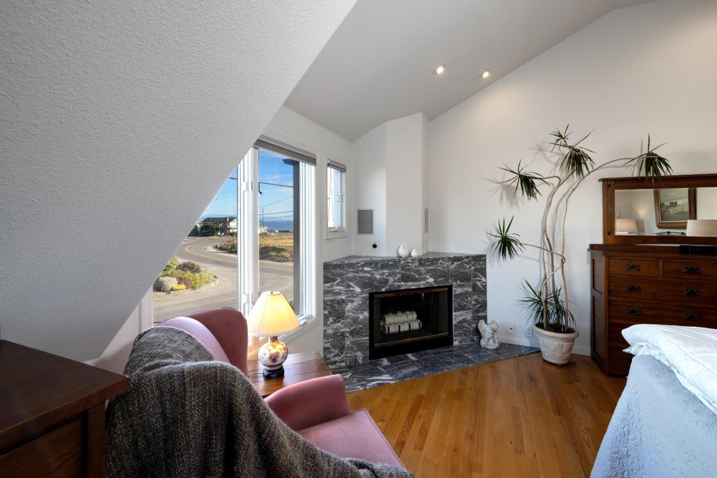 202 Seacliff Drive Aptos, CA 95003 - Photo 14 of 36 a living room with furniture and a fireplace