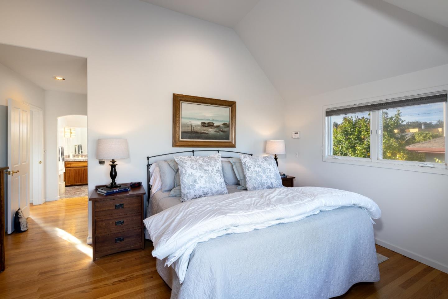 202 Seacliff Drive Aptos, CA 95003 - Photo 15 of 36 a large bedroom with a bed and wooden floor