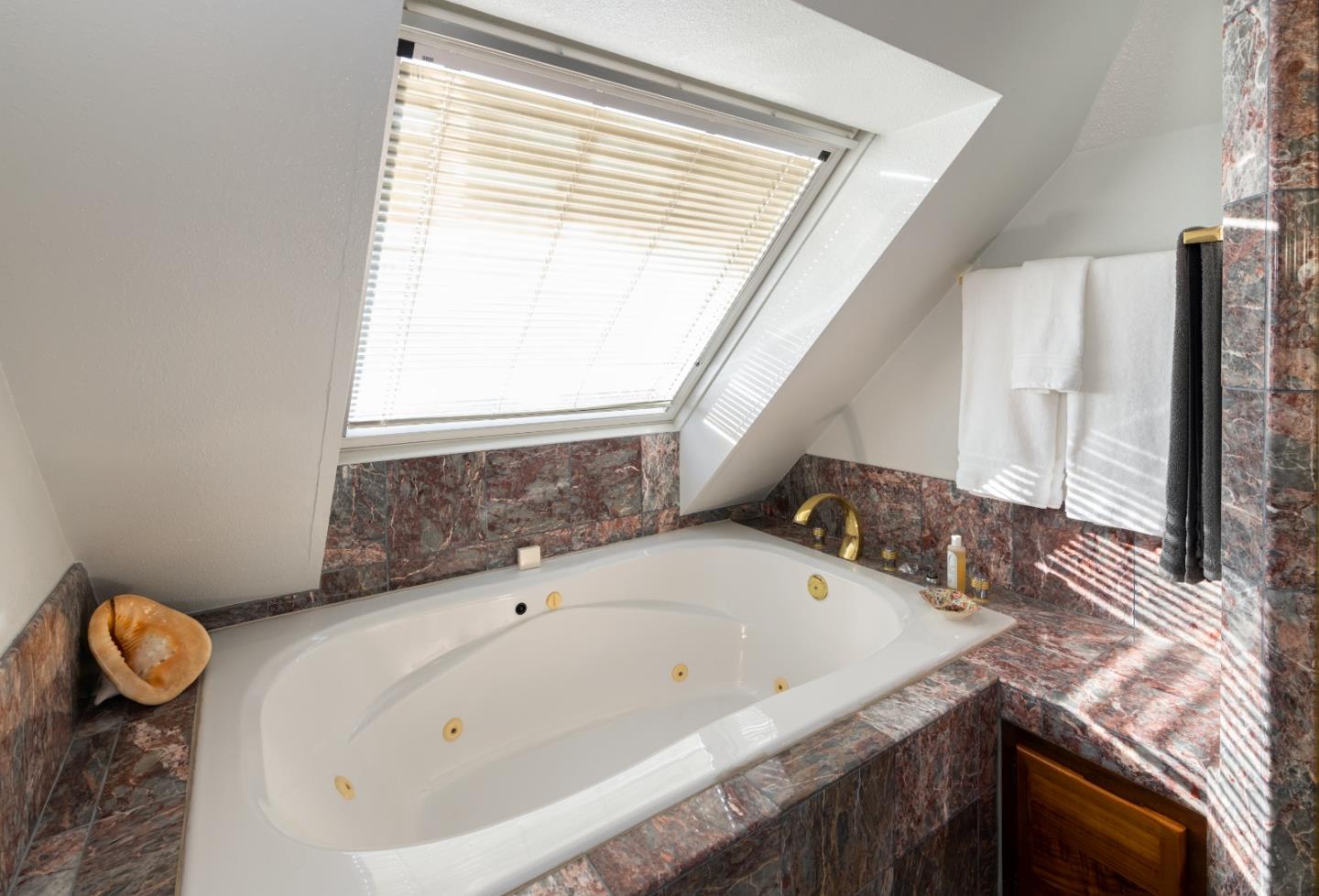 202 Seacliff Drive Aptos, CA 95003 - Photo 17 of 36 a bathroom with a granite countertop sink and a mirror