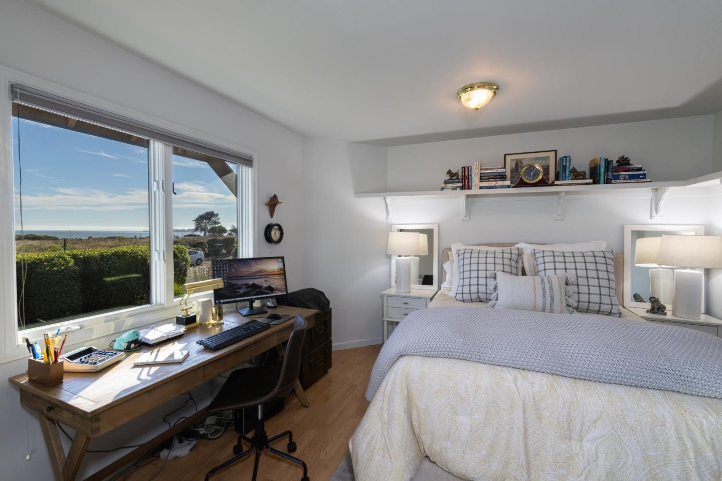 202 Seacliff Drive Aptos, CA 95003 - Photo 18 of 36 a bedroom with a bed and a flat screen tv