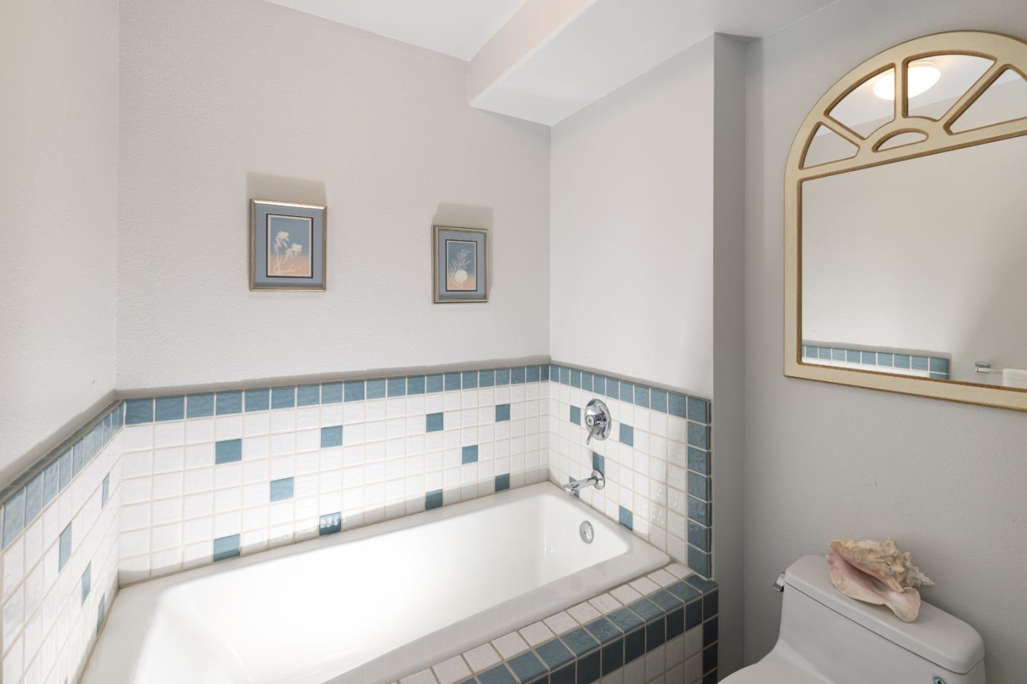 202 Seacliff Drive Aptos, CA 95003 - Photo 22 of 36 a bathroom with a tub and a toilet