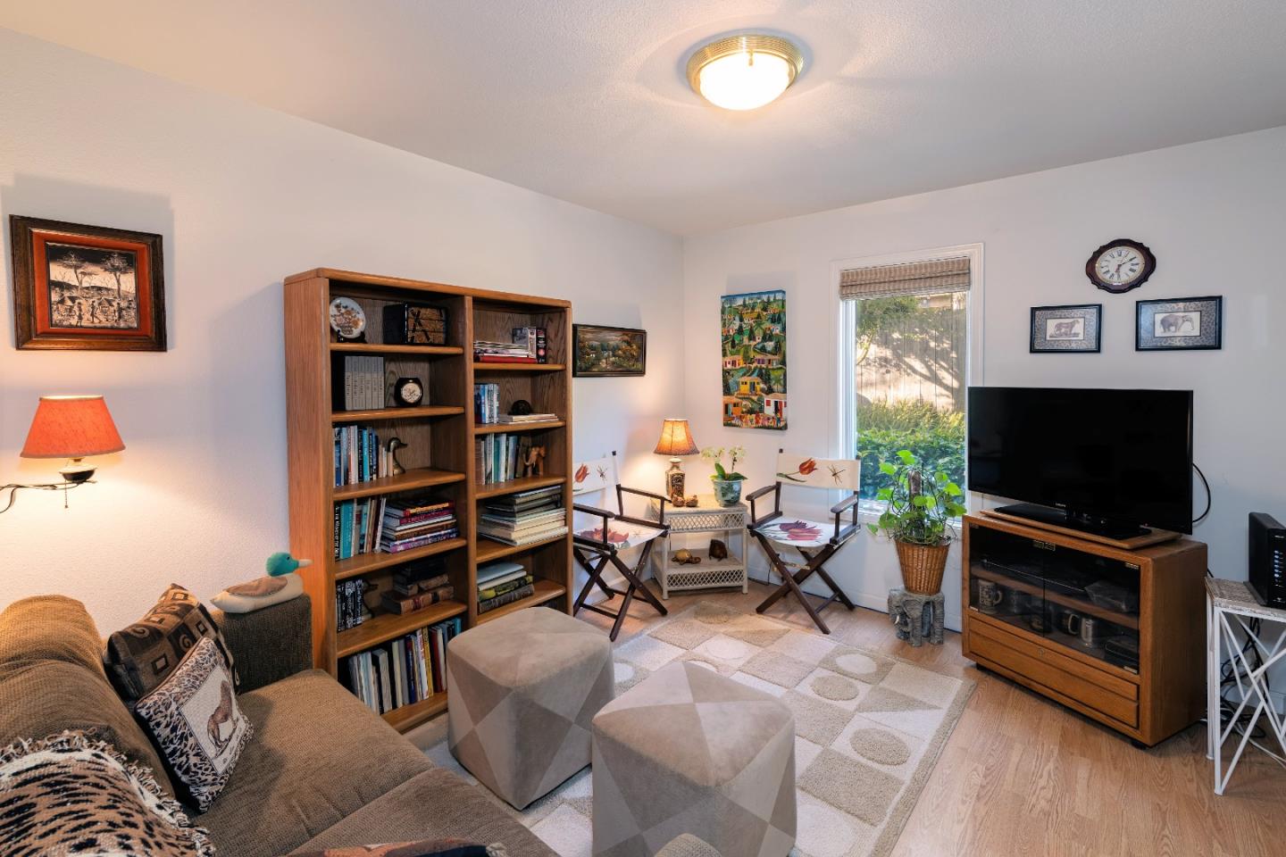 202 Seacliff Drive Aptos, CA 95003 - Photo 25 of 36 a living room with furniture and a flat screen tv