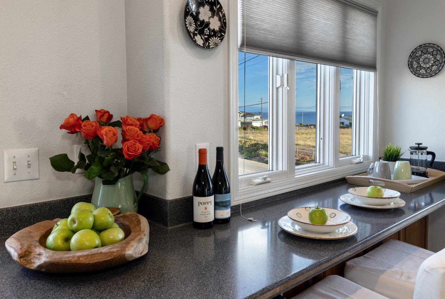 202 Seacliff Drive Aptos, CA 95003 - Photo 9 of 36 a kitchen with a table and a sink