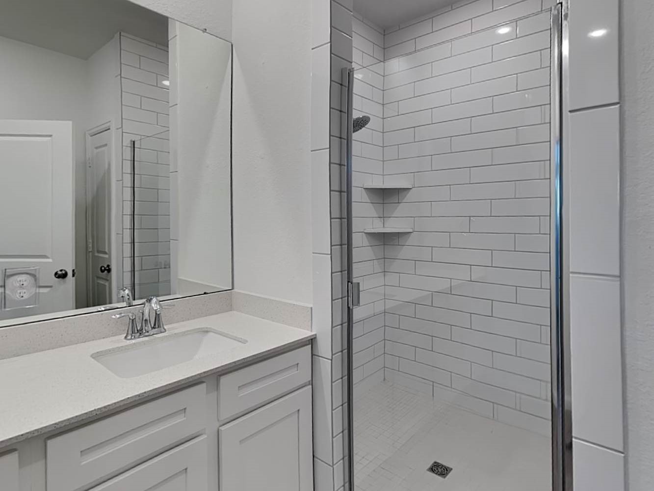 4023 Champlain Way Rosharon, TX 77583 - Photo 9 of 14 a bathroom with a shower and a sink