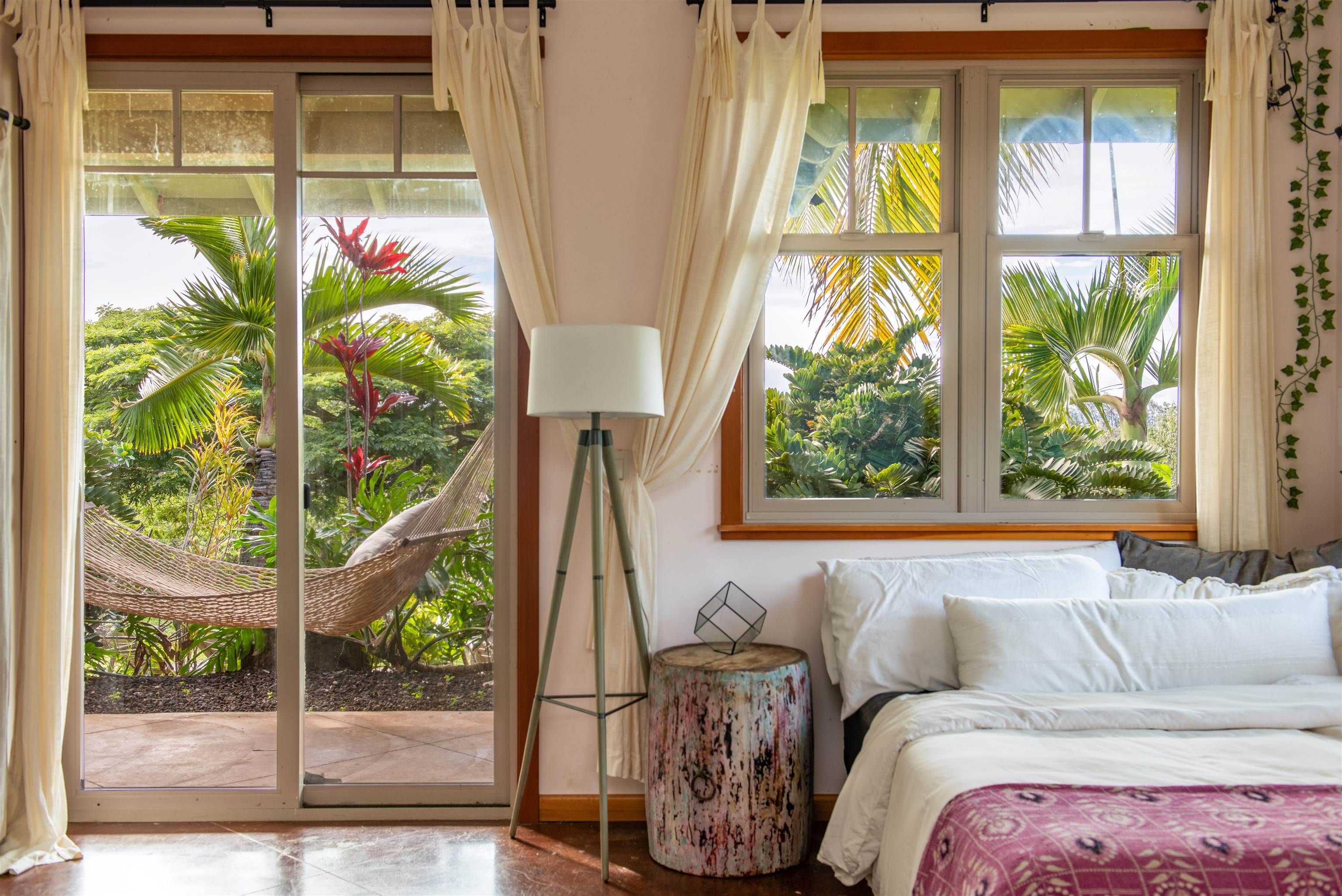 52 Papio Way, Unit A Haiku, HI 96708 - Photo 15 of 50 a living room with a large window and a potted plant