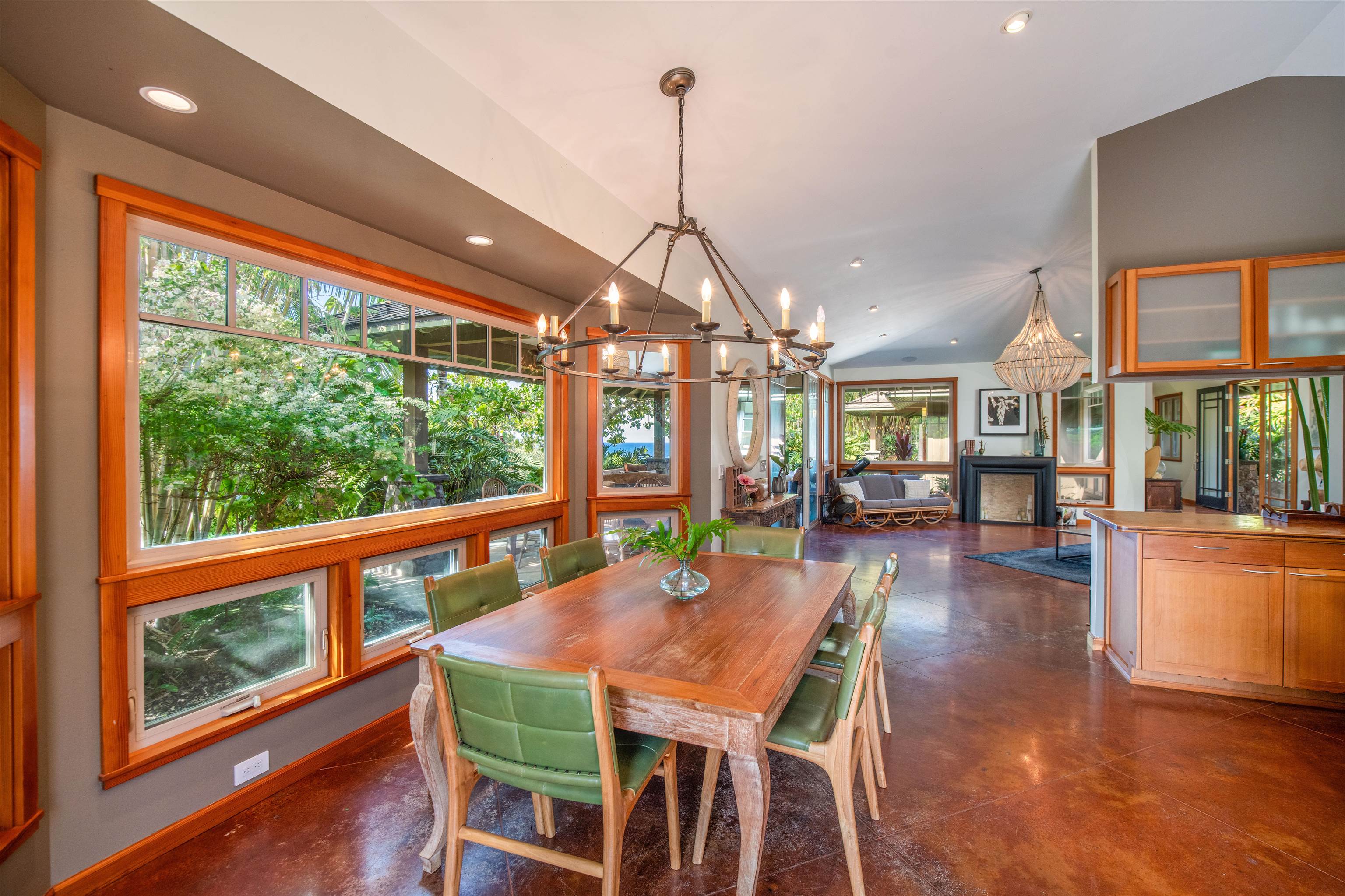 52 Papio Way, Unit A Haiku, HI 96708 - Photo 18 of 50 a view of a dining room with furniture large windows and wooden floor