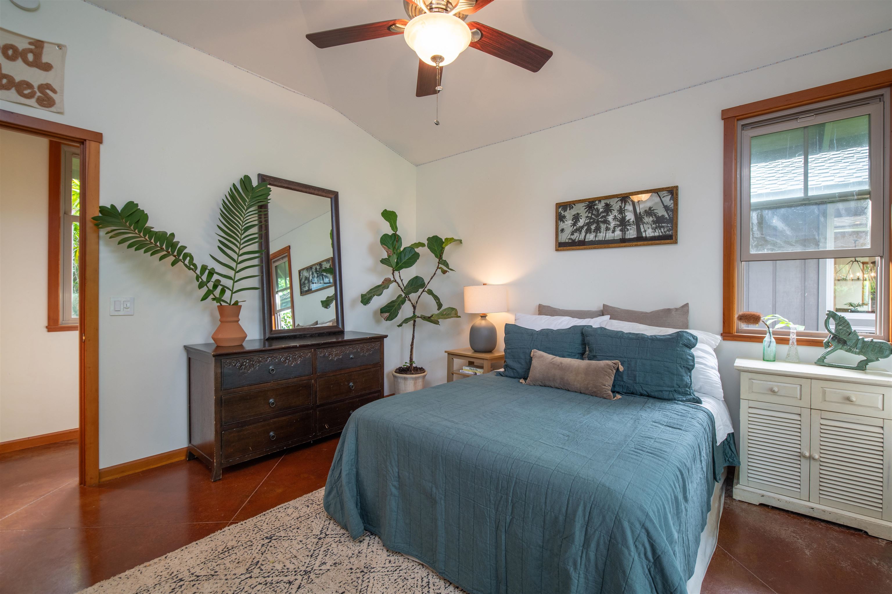 52 Papio Way, Unit A Haiku, HI 96708 - Photo 32 of 50 a bedroom with a bed and a dresser